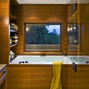 This Japanese-styled bathroom features a large bathtub with cabinetry, ceiling, countertop, interior design, kitchen, room, brown