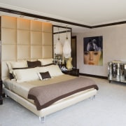 View of the master bathroom which is entered bed frame, bedroom, ceiling, furniture, interior design, room, suite, wall, gray