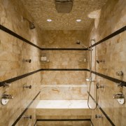 View of the master bathroom which is entered bathroom, ceiling, floor, interior design, room, tile, wall, wood, brown, orange