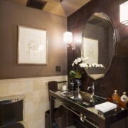 View of bathroom and toilet featuring vanity with bathroom, ceiling, home, interior design, room, suite, black, brown