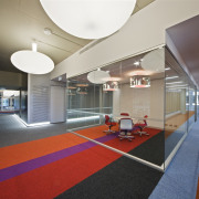 Innovative lighting and colourful striped carpet tiles are architecture, ceiling, floor, flooring, interior design, leisure centre, lobby, real estate, structure, gray