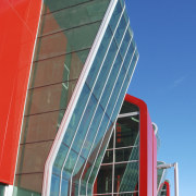 Image of curved glazing from on this fire architecture, building, commercial building, corporate headquarters, daylighting, daytime, facade, headquarters, landmark, line, metropolitan area, real estate, sky, skyscraper, structure, urban area, window, blue