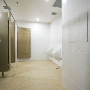 Bathrooms on each level of the building feature architecture, bathroom, ceiling, daylighting, floor, flooring, interior design, lobby, property, real estate, room, tile, wall, wood flooring, gray