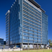 Green Square North Tower cuts a dramatic shape architecture, building, city, commercial building, condominium, corporate headquarters, daytime, facade, headquarters, metropolis, metropolitan area, mixed use, real estate, residential area, sky, skyscraper, tower block, urban area, blue