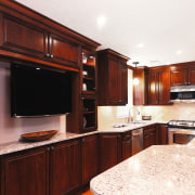 Image of a kitchen and features cabinetry from cabinetry, countertop, cuisine classique, hardwood, home, interior design, kitchen, property, real estate, room, under cabinet lighting, red, white