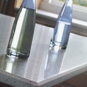 Image of the new Life Series Silestone Quartz bottle, glass, glass bottle, water, gray