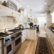 View of a kitchen which was designed by cabinetry, countertop, cuisine classique, home, interior design, kitchen, real estate, room, gray