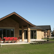 This home, built by Peter Vossen Builders of cottage, estate, facade, farmhouse, home, house, property, real estate, roof, villa, brown, teal