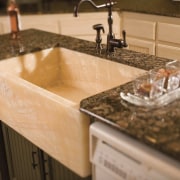 De La Fontera can custom design and handcraft countertop, granite, kitchen, sink, orange, brown