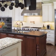 Soft white cabinets are paired with a cherry cabinetry, countertop, cuisine classique, interior design, kitchen, room, gray