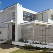 This contemporary home is the product of co-operation architecture, building, elevation, estate, facade, home, house, official residence, property, real estate, residential area, window, gray
