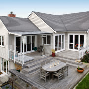 MetroShingle, used to re-roof this older-style home, this backyard, cottage, elevation, estate, facade, farmhouse, home, house, outdoor structure, porch, property, real estate, residential area, roof, siding, white, gray