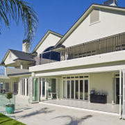 Large internal and external bifold doors open up architecture, building, elevation, estate, facade, home, house, mansion, property, real estate, residential area, roof, villa, window, white