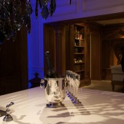 Image of the kitchen island with chandelier and flooring, function hall, house, interior design, light, lighting, restaurant, black, orange