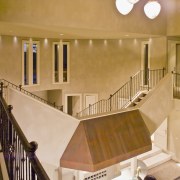 Elephant Plasterboard was also specified for its high architecture, baluster, ceiling, daylighting, estate, floor, furniture, handrail, home, house, interior design, lighting, room, stairs, table, wall, wood, orange