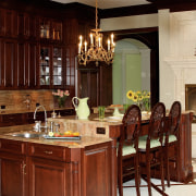 The handcrafted cherrywood cabinetry includes a multifunctional, furniture-styled cabinetry, countertop, cuisine classique, dining room, furniture, interior design, kitchen, room, red