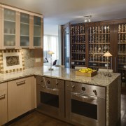 This apartment had a wine storage area fitted cabinetry, countertop, cuisine classique, interior design, kitchen, room, brown