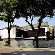 Exterior view of the house which is centered architecture, building, facade, home, house, neighbourhood, plant, property, real estate, residential area, tree, black, white