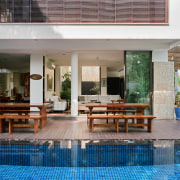 Exterior view of the pool and patio area condominium, estate, furniture, home, house, interior design, outdoor furniture, patio, property, real estate, resort, swimming pool, table, gray