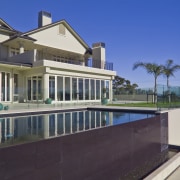 The 10.5m x 5m sprayed-concrete pool was built apartment, architecture, building, condominium, estate, facade, home, house, mansion, property, real estate, residential area, sky, swimming pool, villa, window, blue, black