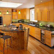 The focal point of this kitchen is the cabinetry, countertop, cuisine classique, floor, flooring, hardwood, interior design, kitchen, real estate, room, wood flooring, brown, orange