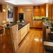 The focal point of this kitchen is the cabinetry, countertop, cuisine classique, floor, flooring, hardwood, interior design, kitchen, real estate, room, wood, wood flooring, brown, orange