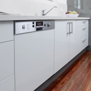 The semi-intergrated dishwasher is whisper quiet. - The cabinetry, countertop, floor, hardwood, home appliance, kitchen, kitchen appliance, kitchen stove, major appliance, product, gray