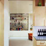 View of kitchen which features a separated living cabinetry, furniture, interior design, kitchen, room, shelf, shelving, orange