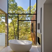 The centre piece of the bathroom is an architecture, bathroom, daylighting, estate, home, house, interior design, real estate, room, window, gray, brown