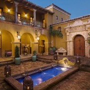 Image of the exterior of this new home. courtyard, estate, hacienda, home, property, real estate, swimming pool, villa, brown