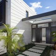 Exterior view of the entrance way featuring cladding, architecture, building, elevation, facade, home, house, property, real estate, residential area, gray