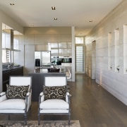 View of the kitchen area which faces into ceiling, floor, interior design, interior designer, living room, real estate, room, gray, white