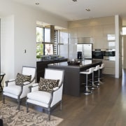 View of the kitchen area which faces into floor, flooring, interior design, living room, property, real estate, room, gray