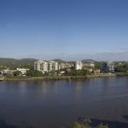 The Waters Edge Developments are set on the bird's eye view, city, cityscape, daytime, horizon, lake, metropolis, metropolitan area, panorama, photography, real estate, reflection, river, sky, skyline, skyscraper, urban area, water, teal