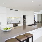 Image of the kitchen which feature a built countertop, cuisine classique, interior design, interior designer, kitchen, property, real estate, room, gray, white