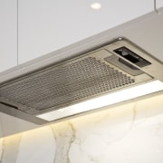 Image of the fully concealedrangehood which provides great lighting, product design, white