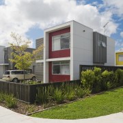 This Housing New Zealand Devlopment features modular homes, architecture, corporate headquarters, elevation, facade, home, house, neighbourhood, property, real estate, residential area, white