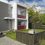 This Housing New Zealand Devlopment features modular homes, architecture, building, cottage, facade, home, house, property, real estate, residential area, gray