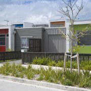 This Housing New Zealand Devlopment features modular homes, architecture, building, elevation, facade, home, house, neighbourhood, property, real estate, residential area, gray