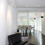 A shot of the white painted contemporary minimalist ceiling, daylighting, floor, interior design, living room, real estate, room, table, gray, white