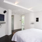 View of the master bedroom featuring walnut flooring, bedroom, ceiling, floor, home, interior design, property, real estate, room, white