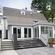 Exterior view of house featuring landscaping, oak roofing, cottage, elevation, estate, facade, home, house, property, real estate, siding, window, gray