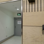 View of Auckland Airport's new international terminal where door, floor, glass, orange, gray