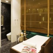 View of the bathtub which has a cover bathroom, interior design, room, suite, brown