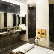 View of bathroom featuring vanity with marble top, bathroom, countertop, interior design, room, black, white