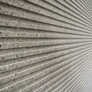 View of the Monarc Marscapone concrete from Nauhria. daylighting, line, material, metal, roof, steel, structure, texture, wall, wood, gray