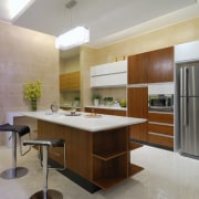 View of kitchen which features a kitchen island cabinetry, countertop, cuisine classique, interior design, kitchen, real estate, room, gray