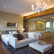 Master suite in a Hong Kong waterside apartment.Featuring ceiling, estate, floor, hardwood, home, interior design, living room, real estate, room, suite, wall, wood flooring, brown, gray