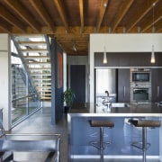 View of kitchen with stainless steel kitchen island, architecture, beam, ceiling, countertop, daylighting, house, interior design, kitchen, loft