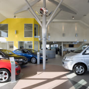 View of Tristram European's new VW showroom which auto show, automobile repair shop, automotive design, building, car, car dealership, city car, motor vehicle, vehicle, gray